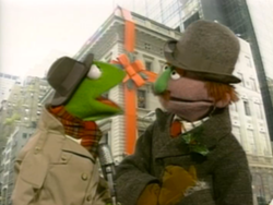 Kermit is accosted by a man whose "kid wants a microphone for Christmas."