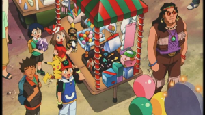 The gang in front of a stand at the Millennium Comet Festival. A colorful scene, but nothing beyond television episode quality.